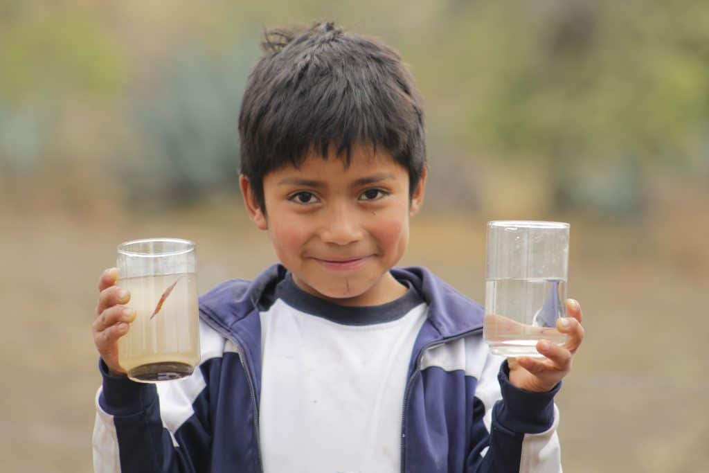 Kid with 2 glasses of water