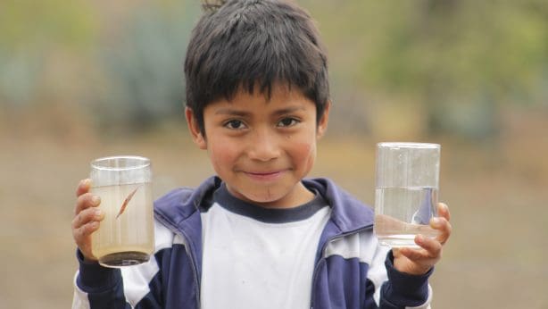 Kid with 2 glasses of water